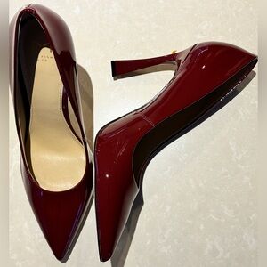 Burgundy patent high heeled shoes in a size 9
